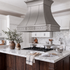Faceted Curved Custom Stainless Steel Range Hood with Polished Straps