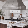 Faceted Curved Custom Stainless Steel Range Hood with Polished Straps