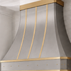 Faceted Curved Custom Stainless Steel Range Hood with Matte Brass Straps and Rivets