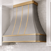 Faceted Curved Custom Stainless Steel Range Hood with Matte Brass Straps and Rivets