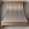 Faceted Curved Custom Stainless Steel Range Hood with Matte Brass Straps and Rivets