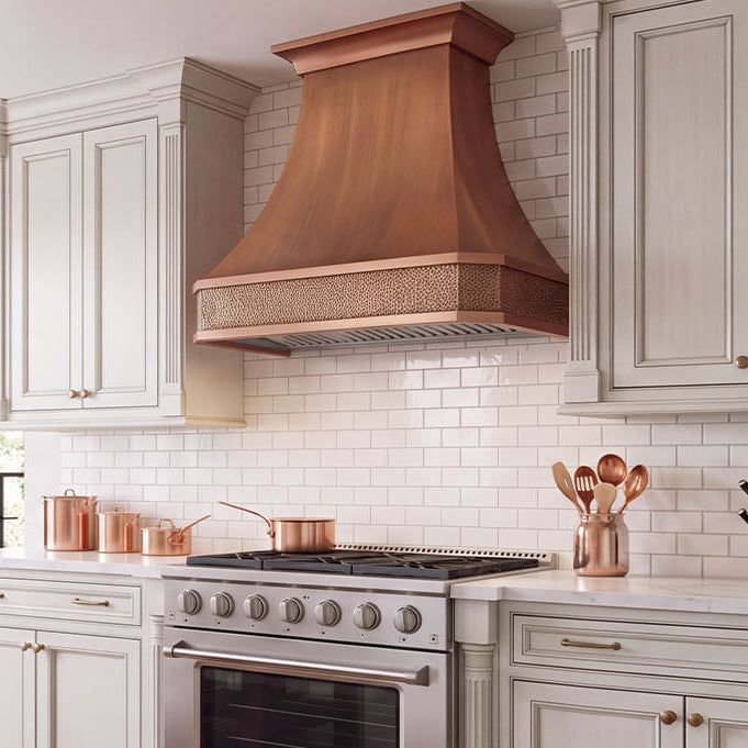 Faceted Curved Custom Copper Range Hood with Hammered Apron