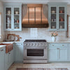 Bell-Shaped Custom Copper Range Hood with Straps and Hammered Apron