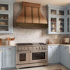 Bell-Shaped Custom Copper Range Hood with Straps and Hammered Apron
