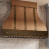 Bell-Shaped Custom Copper Range Hood with Straps and Hammered Apron