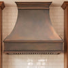 Smooth Curved Custom Copper Range Hood with Streamlined Apron