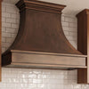 Smooth Curved Custom Copper Range Hood with Streamlined Apron