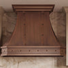 Faceted Curved Custom Copper Range Hood with Riveted Panels and Apron