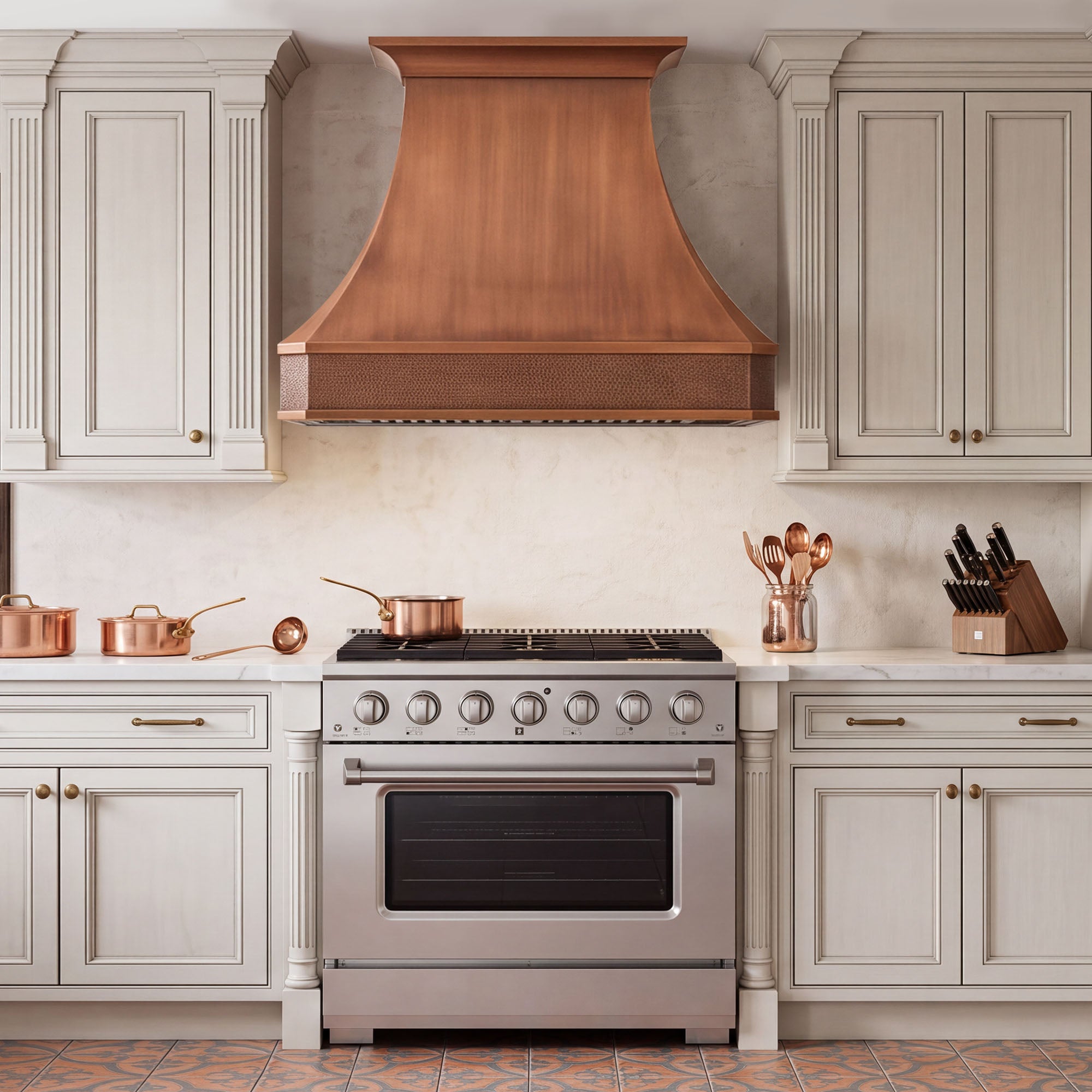 Traditional kitchen with handcrafted custom copper curve shape range hood and hammered apron detail